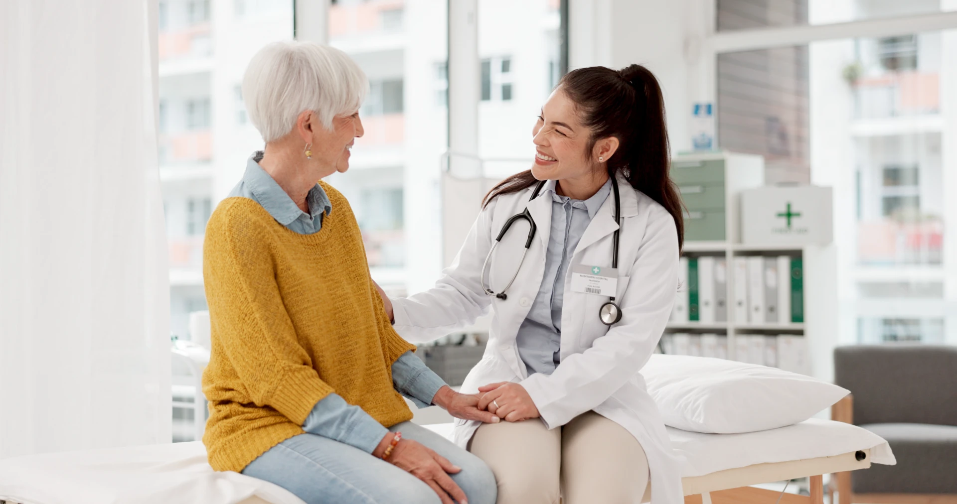 Holding hands happy doctor with patient consultation